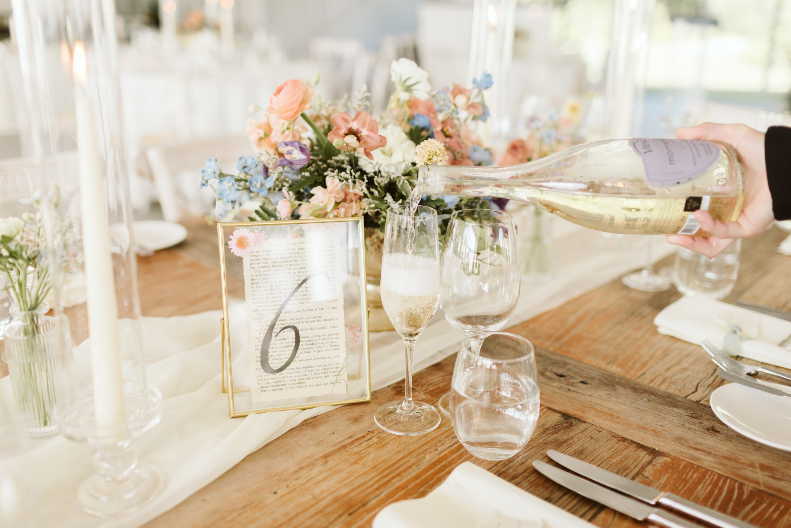 Bookish wedding table number DIY. Photo by Maddie Mellott